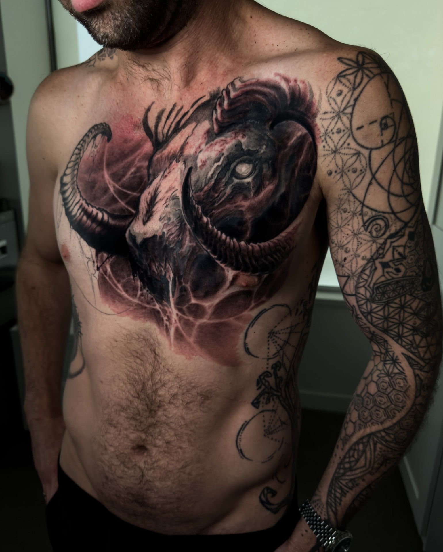 Black-and-grey horned demon back tattoo by Andrew Stopay