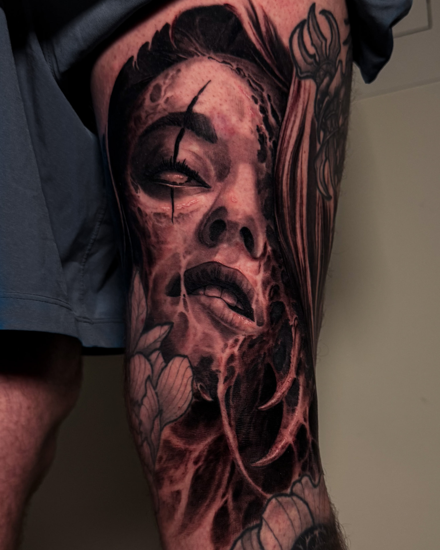 Black-and-grey dark fantasy portrait forearm tattoo by Andrew Stopay