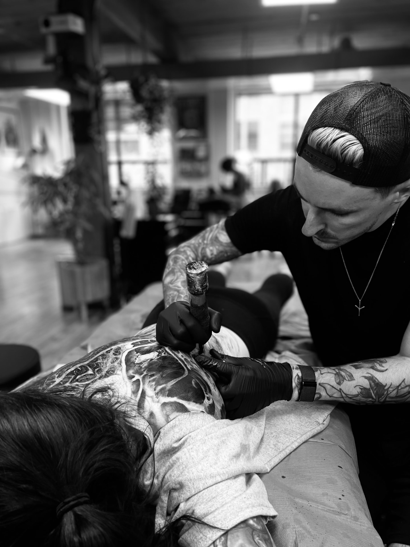 Andrew Stopay tattooing a client at Anima Tattoo